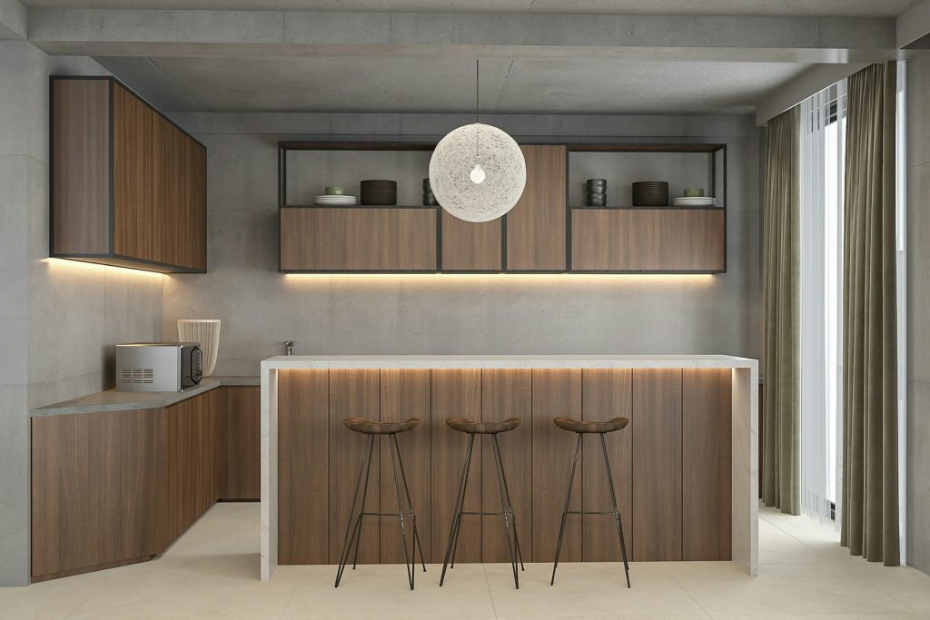 A walnut and concrete kitchen with a marble-topped island and three stools