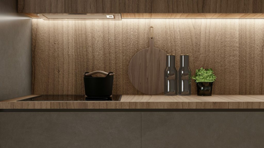 A walnut kitchen wall with an induction hob and a stone counter